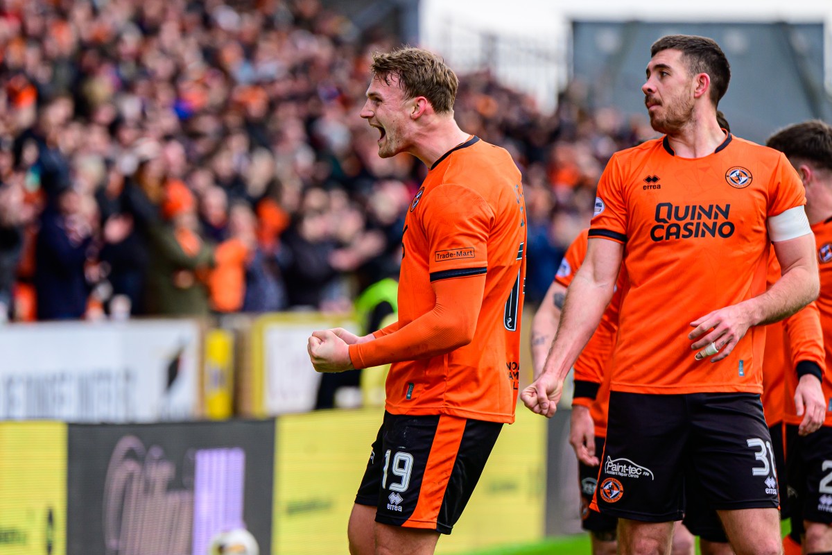 Sam Dalby celebrates with the United supporters 